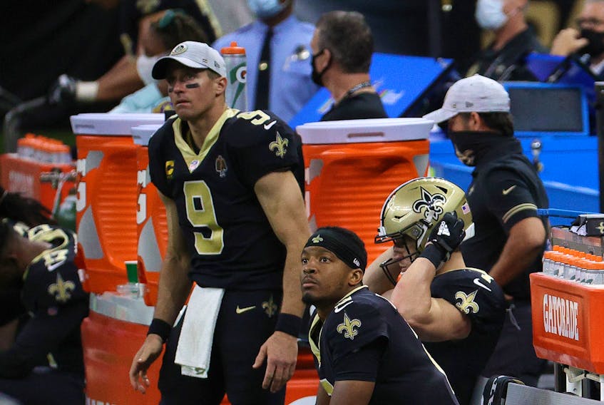 New Orleans' Jameis Winston (sitting) talked glowingly of Drew Brees on Tuesday.