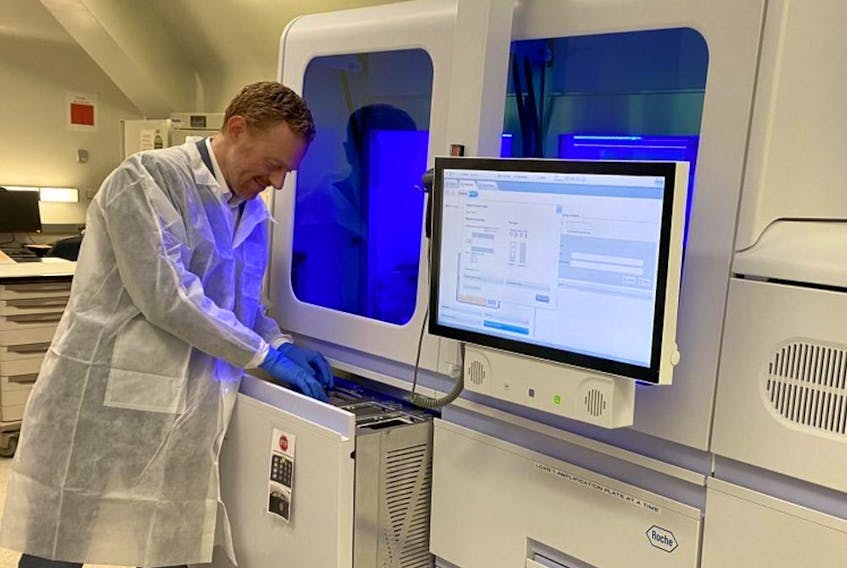 A pair of automated testing machines at St. Paul's Hospital, pictured, typically used for HIV and hepatitis B, have been successfully repurposed to analyze COVID-19 testing swabs.