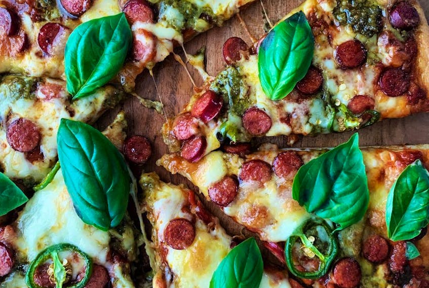 Pepperoni pizza with basil and honey (Renee Kohlman)