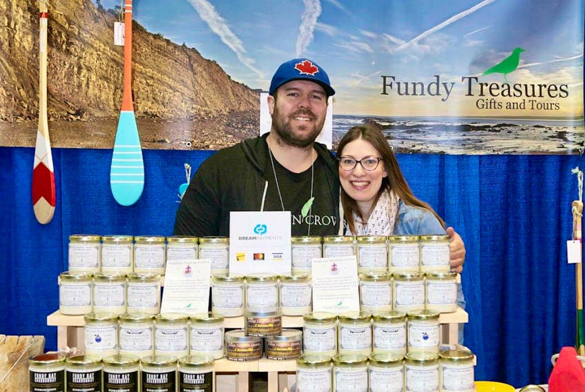 Proud business owners Brian and Laura Hebert at one of their weekly markets. Business is booming for the couple, who are launching the newest aspect of their business: a co-operative retail location.