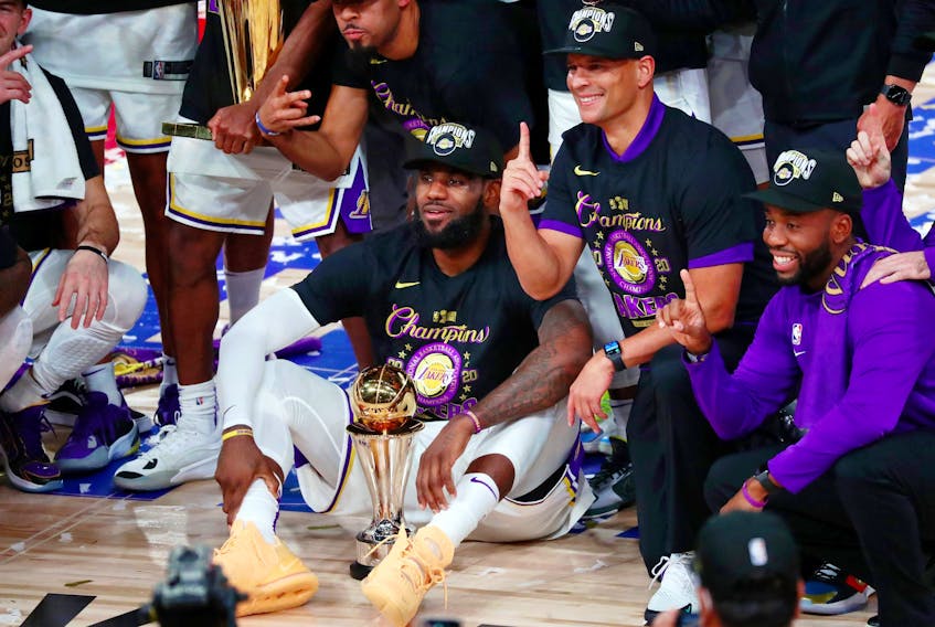 The Los Angeles Lakers pose for a photo after winning the NBA championship.