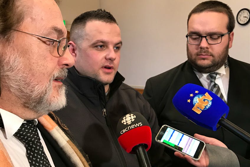 Steven Neville and his defence lawyers Bob Buckingham (left) Robert Hoskins (right) speak to the media following the jury verdict Friday at Newfoundland and Labrador Supreme Court in St. John's. Neville was found not guilty of second-degree murder and attempted murder.