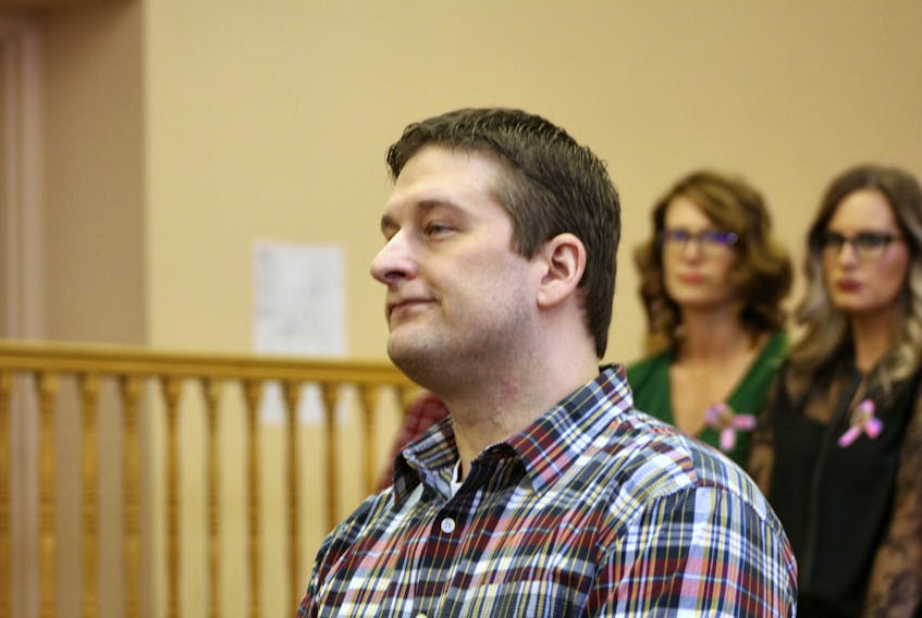 Trent Butt appears in Newfoundland and Labrador Supreme Court in St. John's Monday morning, accused in the murder of his five-year-old daughter, Quinn. Behind him, Quinn's mother, Andrea Gosse (right) and her supporters sit in the courtroom gallery.