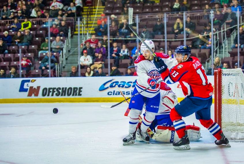 Defenceman Ryan Johnston (7) shown in action against Chase Balisy (13) and the Springfield Thunderbirds at Mile One Centre earlier this season, is back with the IceCaps after the parent Montreal Canadiens made a trade late Thursday to add to their defensive depth.