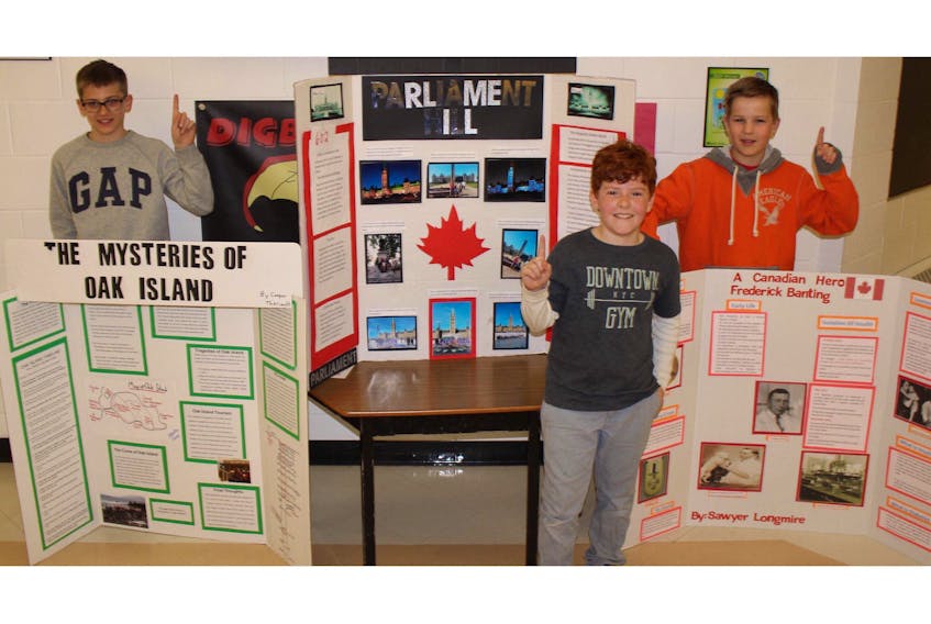Grade 6 students at Digby Elementary Cooper Theriault, Isaiah Manzer and Sawyer Longmire had the top three projects in their grade at the annual heritage fair. - Amanda Doucette