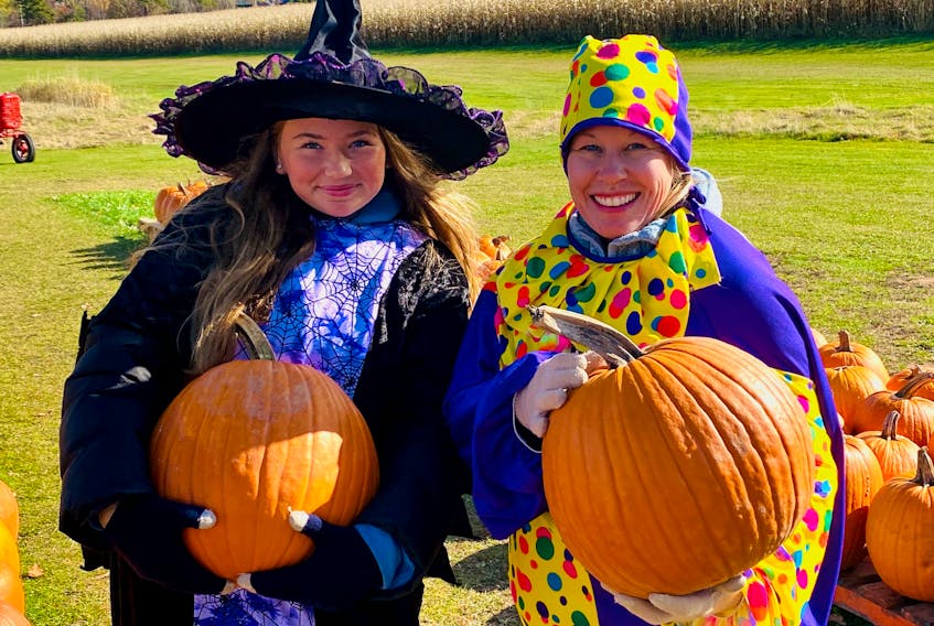 Bijou Perey, left, and Tania MacKenzie of MacKenzie Produce in Stratford are dressed for Halloween while selling pumpkins and welcoming people to the popular corn maze today. Motorists are asked to keep a close eye out for any trick-or-treaters that are out and about this evening. Children should be accompanied by an adult, wearing costumes that are brightly coloured and reflective and are adhering to the Chief Public Health Office’s guidelines for going door-to-door and limiting contact. All treats should be checked by an adult before consuming. Garth Hurley/The Guardian
