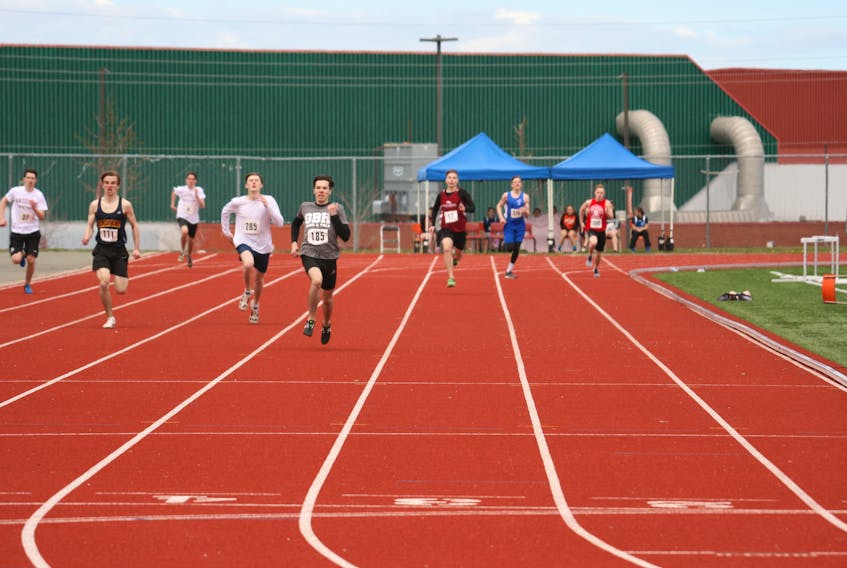 Runners are shown participating in the Nova Scotia School Athletic Federation Highland region track and field regionals at the Cape Breton Health Recreation Complex in Sydney on Friday. From left, Dell Welton (Baddeck Academy), Michael Cameron (Baddeck Academy), Nolan Beaton (Dalbrae Academy), Ryan Drohan (Riverview High School), Braeden Hiscock (Glace Bay High School), Liam Krieger (Baddeck Academy), Eric Wall (Sydney Academy) and Dylan MacDonald (Riverview High School). Photo/Greg Myatt