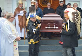 The casket belonging to Grand Chief Ben Sylliboy was led outside St. Kateri Holy Trinity Roman Catholic Church in We’koqma’q by pallbearers. The longtime leader was remember as a kind and humble man at his funeral, Saturday, which was filled to capacity with standing room only available inside the church. Jeremy Fraser/Cape Breton Post
