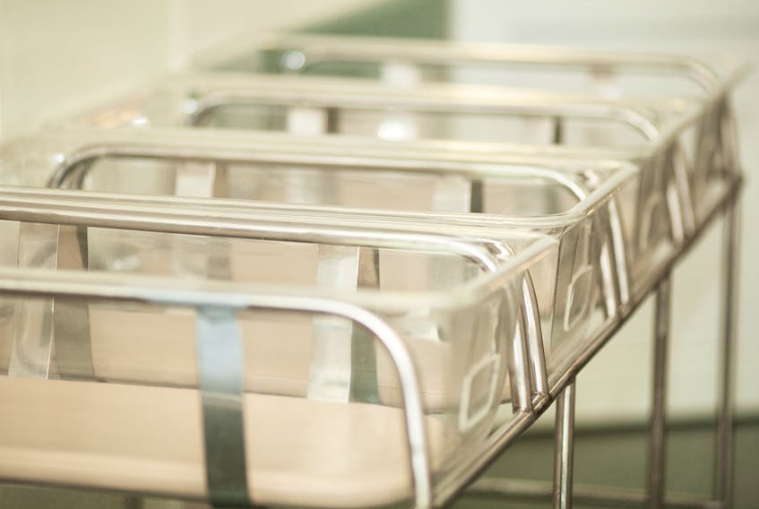A row of empty baby beds in the maternity ward of a hospital. - 123rf.com