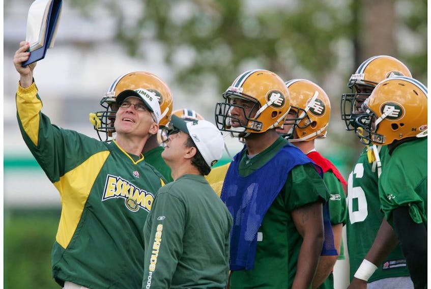 This is a file photo of Edmonton Eskimos head coach Tom Higgins during a practice at Clarke Stadium from August 6, 2004. On Wednesday, he was named defensive co-ordinator of the University of Alberta Golden Bears.