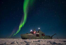 HMCS Harry DeWolf under the Northern Lights.