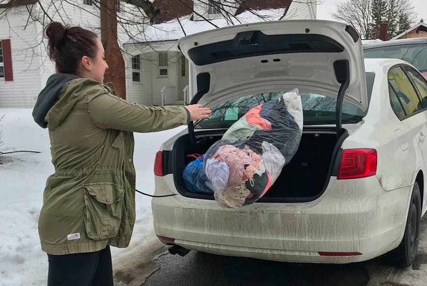 Tristen Haley, a member of the Mount Allison women's rugby team, has cleaned out her own closet in readiness for the squad's clothing drive that is under way this month. Sackville-area residents are encouraged to join in and donate to the cause.