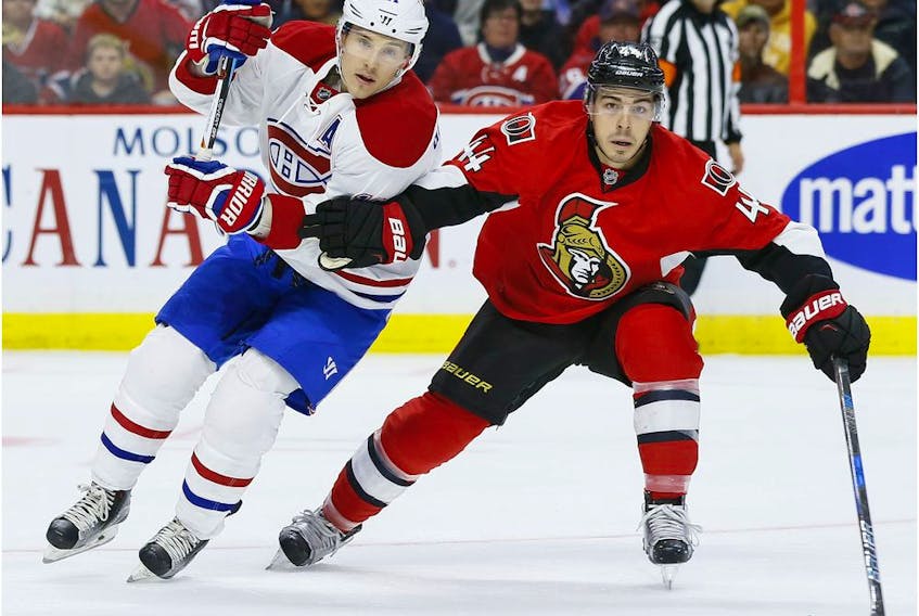  Canadiens winger Brendan Gallagher and Senators centre Jean-Gabriel Pageau battle for position during a game in Ottawa during the 2016-17 season.