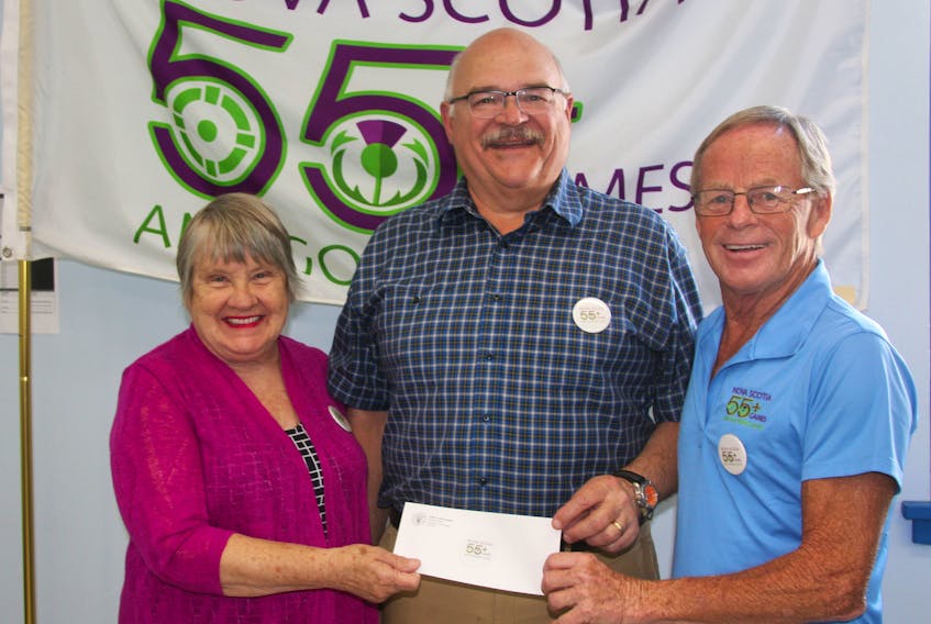 The Maples: Supportive Living owner Steve Smith makes a diamond sponsorship contribution of $7,500 to the Nova Scotia 55 + Games which are coming to Antigonish town and county Aug. 1 to 3. Accepting the check are co-chairs Diane Roberts and Vaughn Chisholm.