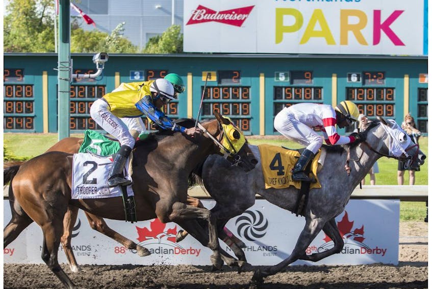 Jockey Rico Walcott  on Chief Know It All came up the middle to win at the 88th running of the Canadian Derby at Northlands park in Edmonton on Saturday Aug. 19, 2017.