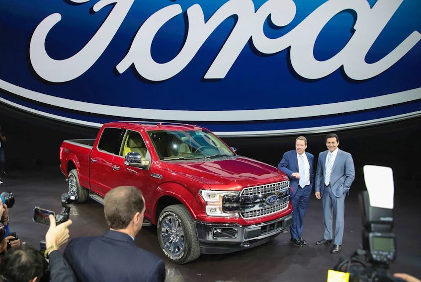 Bill Ford (L), Executive Chairman of Ford and Mark Fields, President and CEO, show off Ford's new F150 at the North American International Auto Show on January 9, 2017 in Detroit, Michigan. The show is open to the public from January 14-22.