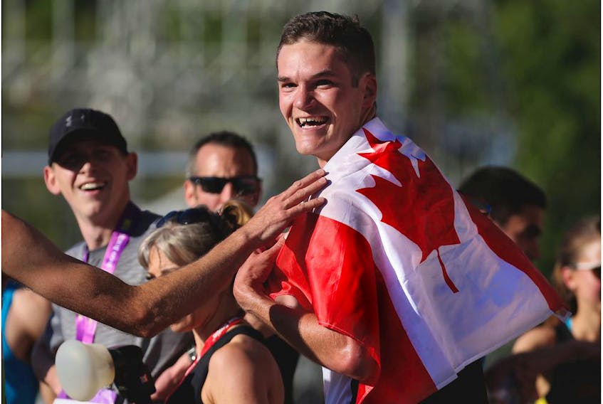 Calgary's Trevor Hofbauer was all smiles after winning the Centaur Subaru Half Marathon event at the Scotiabank Calgary Marathon at Stampede Park on Sunday May 27, 2018. Gavin Young/Postmedia