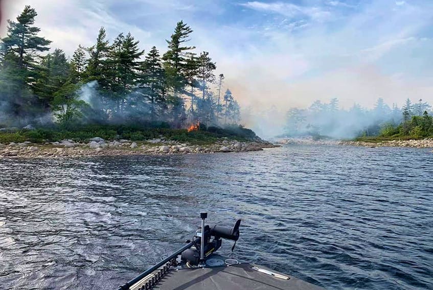 A forest fire in the southern end of Panuke Lake is shown on Wednesday afternoon. Marg Shiers, Facebook