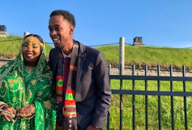 Abawajy dressed in Oromo traditional clothes and Youssouf wearing an Oromo scarf stood at the top of Citadel Hill to greet friends and family who stayed in their cars.