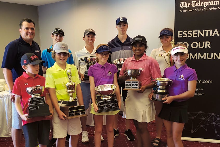End of the year award-winners pose with their trophies after the Tour Championship, the final event of the 2019 Tely Junior Golf Tour, held Monday at the Terra Nova Resort in Port Blandford. Shown (from left) are, front row: bantam boys champion Griffen Gallant, West Coast Swing Award winner Sam Bugden, most improved female player Rosie Allen, bantam girls champion Sanjana Gullipalli and Hutchinson Trophy winner Kali Gill; back row: The Telegram’s Reader Sales and Service manager Rob Squires, junior boys champion Luke Lahey, juvenile boys champion Ethan Efford, most improved male player Geoff Kerr and junior girls champion Taylor Cormier