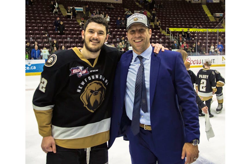 Newfoundland Growlers forward Brad Ferguson (left) celebrates with Ryane Clowe after the Growlers captured the ECHL’s Kelly Cup championship at Mile One Centre Tuesday night. Ferguson was one of about a dozen rookies of the team and Clowe, who began the 2018-19 as Newfoundland’s head coach before being forced to step down because of health issues, says a key to the team’s success was how the young players came together.