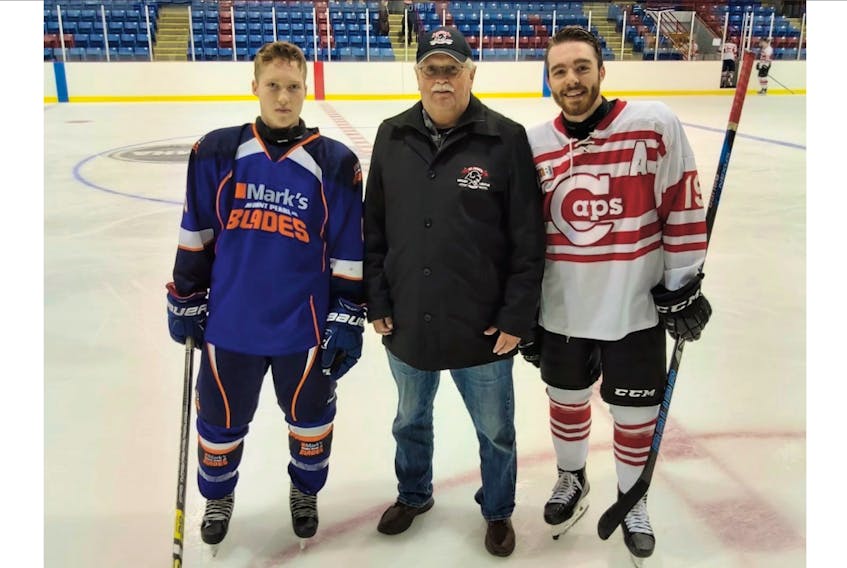 Noah Harty (left) of the Mount Pearl Blades and Kyle McGrath (right) of the St. John's Caps, shown flanking league executive member Jim Hare, were named players of the game in Sunday night's Mary Bown's St. John's Junior Hockey League game at the Glacier in Mount Pearl. — Submitted