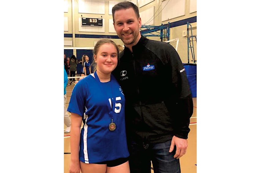 Brad Gushue congratulates his daughter Hayley after she and her St. Peter’s Grade 7 teammates won the Cowan Heights Invitational volleyball tournament Saturday in St. John’s. Gushue and his 12-year-old daughter will team up next week as one of 10 entries in the provincial mixed doubles championship. — Twitter/@BradGushue