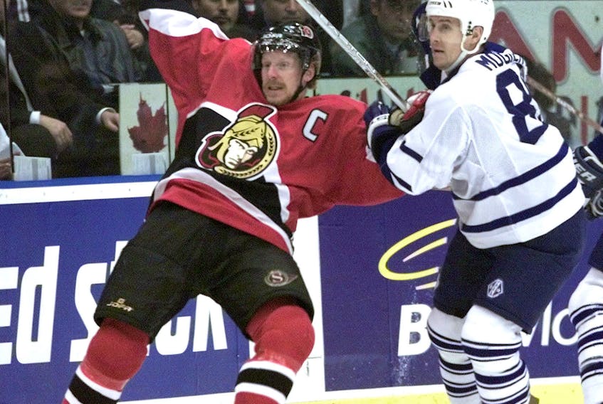 Former rivals Daniel Alfredsson (left) and Alexander Mogilny, seen here battling in the playoffs while with Ottawa and Toronto, respectively, are two of the players believed to be on the bubble for hockey hall of fame selection this year. Jarome Iginla is regarded as a shoo-in.
