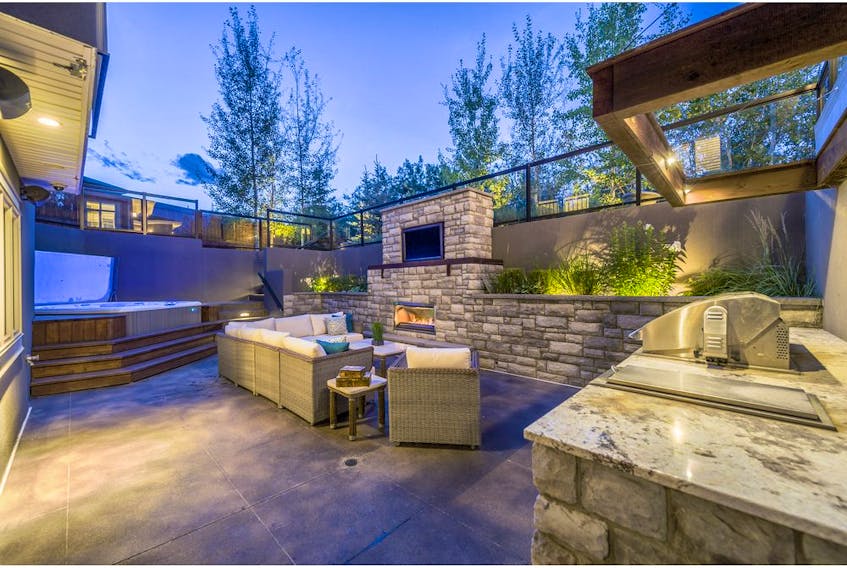 Outdoor renovation by Vision Scapes, Backyards are becoming glamorous, multi-purpose three-season outdoor living spaces, with outdoor kitchens and covered decks. Photo supplied by Vision Scapes