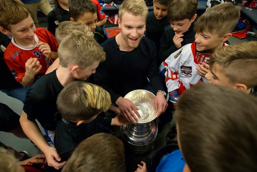St. Louis Blues defenceman Colton Parayko and the Stanley Cup visit Team Brick Alberta players during the Brick Invitational Hockey Tournament at West Edmonton Mall on July 3, 2019.