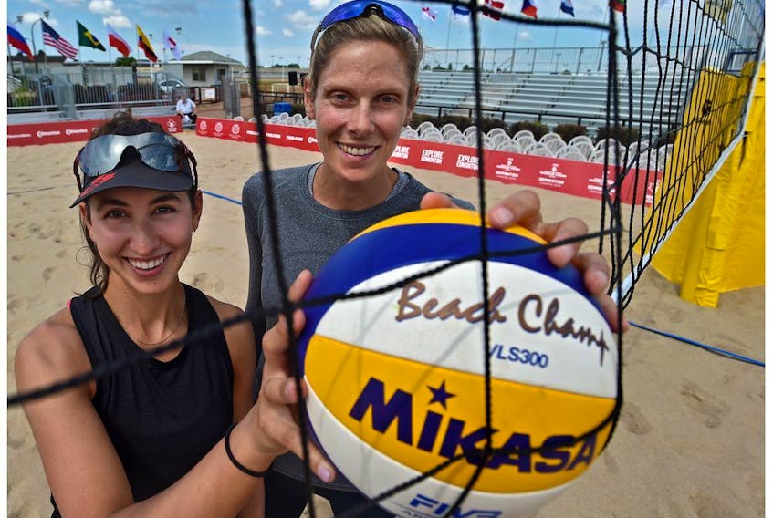 World champs, Canadians Sarah Pavan (R) and Melissa Humana-Paredes at the official kick-off of the FIVB Beach Volleyball World Tour with 90 teams representing 25 countries at the former Northlands Park Race Track in Edmonton, July 16, 2019. 