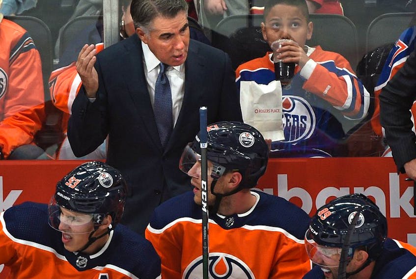  Edmonton Oilers head coach Dave Tippett talks to his players while playing the Calgary Flames during NHL pre-season action on Sept. 20, 2019, at Rogers Place. Ed Kaiser / Postmedia