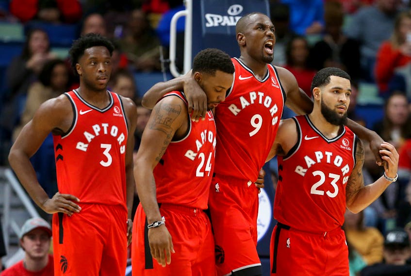 Toronto Raptors forward Serge Ibaka (9) is helped off the court by guards Norman Powell (24) and Fred VanVleet (23) in the second quarter against the New Orleans Pelicans at the Smoothie King Center. Chuck Cook-USA TODAY Sports 