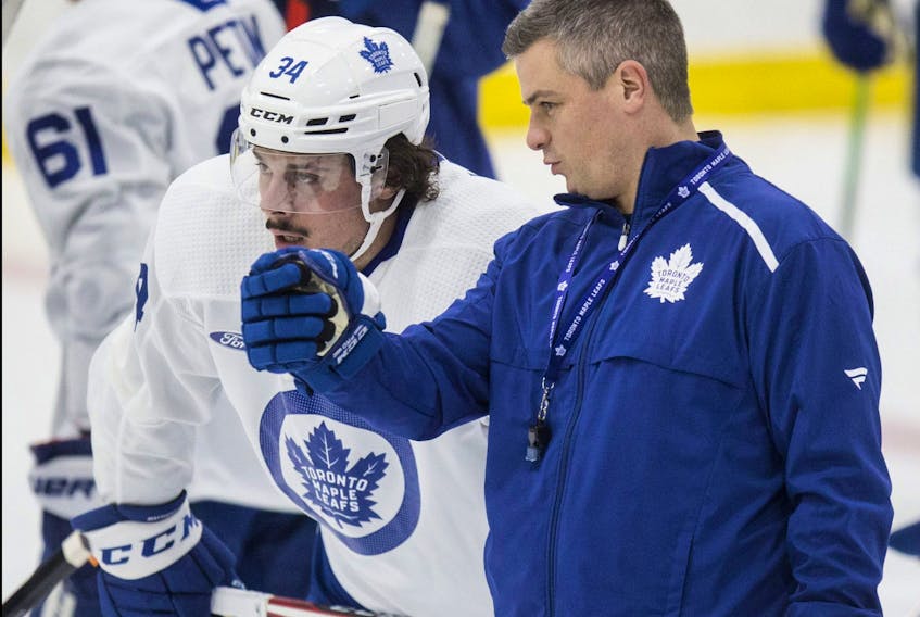 Sheldon Keefe and Auston Matthews talk at Toronto Maple Leafs practice at the Ford Performance Centre in Toronto on Monday November 25, 2019. 