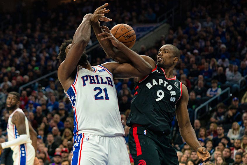 Philadelphia 76ers' Joel Embiid (21) and Toronto Raptors forward Serge Ibaka (9) battle for the ball during the second quarter at Wells Fargo Center on Sunday night. Bill Streicher-USA TODAY Sports 