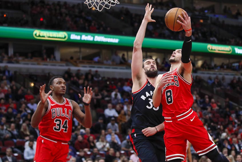 Chicago Bulls guard Zach LaVine (8) goes to the basket against Toronto Raptors centre Marc Gasol (33) during the first half at United Center. Mandatory Credit: Kamil Krzaczynski-USA TODAY Sports 
