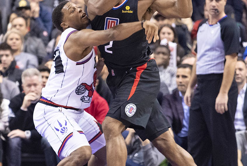 LA Clippers forward Kawhi Leonard (2) controls a ball as Toronto Raptors guard Kyle Lowry (7) tries to defend during the third quarter at Scotiabank Arena. Nick Turchiaro-USA TODAY Sports 