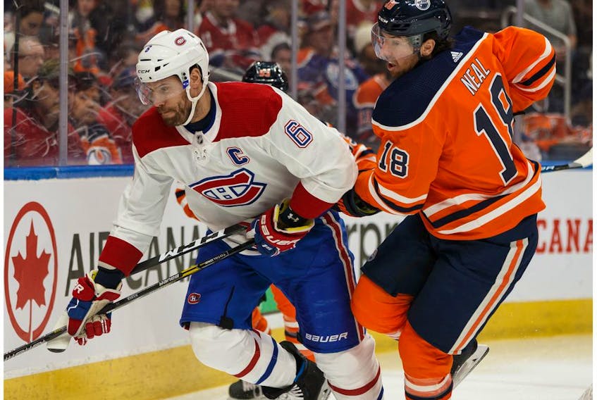 Edmonton Oilers James Neal (18) battles Montreal Canadiens' Shea Weber (6) during first period NHL hockey action at Rogers Place in Edmonton, on Saturday, Dec. 21, 2019. 