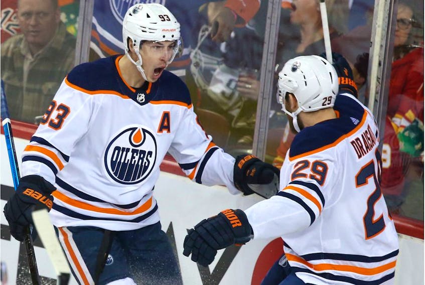 Oilers Ryan Nugent-Hopkins (L) and Leon Draisaitl celebrate the team's first goal of the game during NHL action between the Edmonton Oilers and the Calgary Flames in Calgary on Saturday, January 11, 2020.