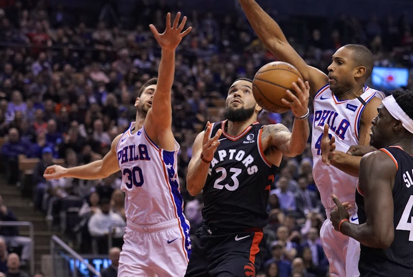 Philadelphia 76ers guard Furkan Korkmaz (30)  and forward Al Horford (42) try to block a shot attempt by Toronto Raptors guard Fred VanVleet (23) during the first half at Scotiabank Arena: John E. Sokolowski-USA TODAY Sports 