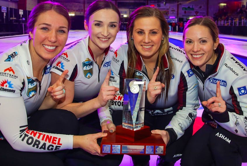 The Alberta Scotties winners - Lead,Nadine Scotland, second, Taylor McDonald, third Kate Cameron and skip Laura Walker - pose with the trophy after defeating Team Kelsey Rocque to win the Alberta Scotties Tournament of Hearts in Okotoks on Jan. 26, 2020.
