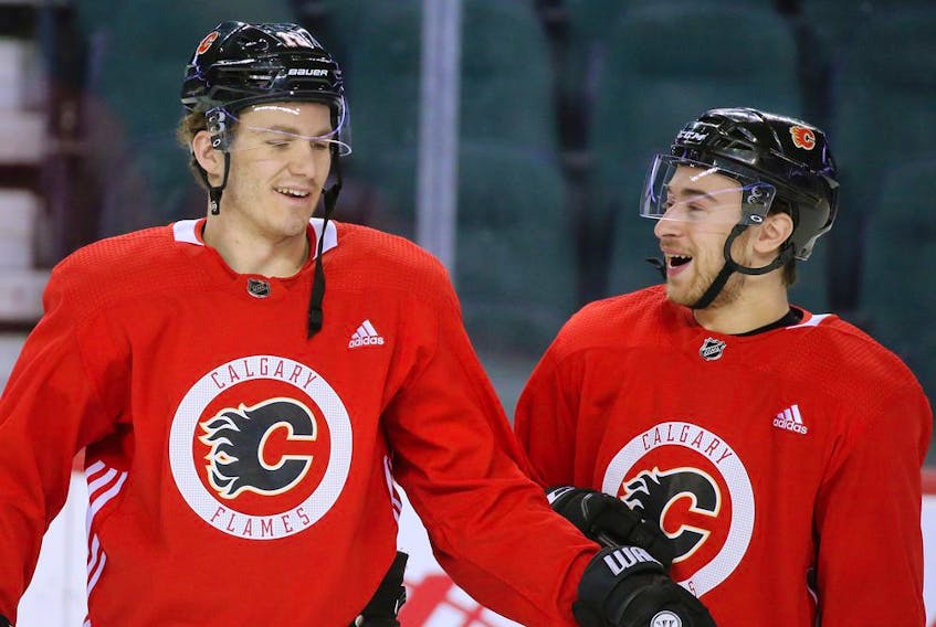 Calgary Flames forward Matthew Tkachuk laughs with teammate Andrew Mangiapane during team practice on Monday, January 27, 2020. Gavin Young/Postmedia