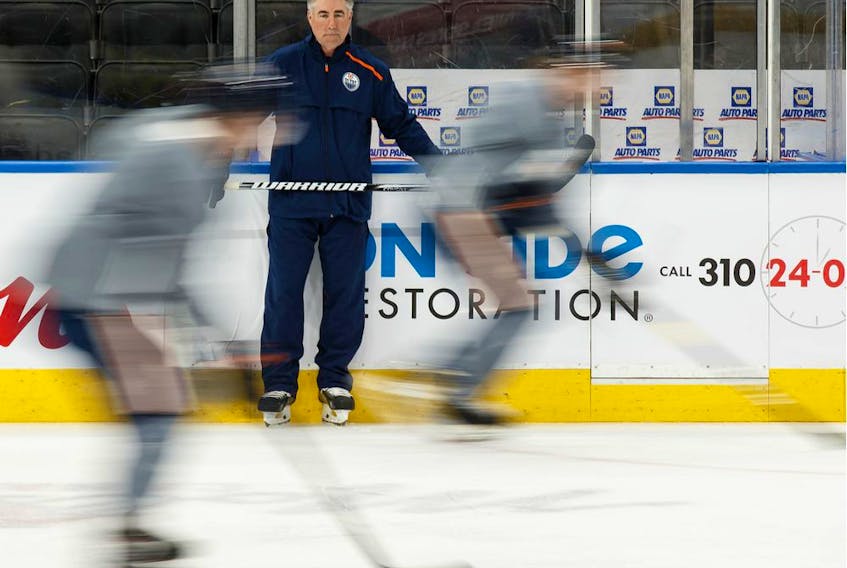 Edmonton Oilers head coach Dave Tippett watches his players during a practice on the ice at Rogers Place on Feb. 7, 2020.