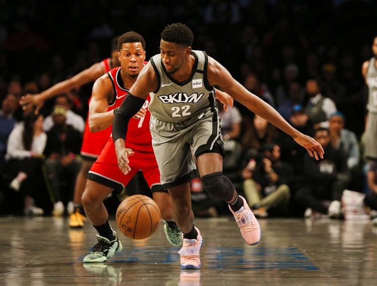 Brooklyn Nets guard Caris LeVert (22) and Toronto Raptors guard Kyle Lowry (7) pursue a loose ball during the first half at Barclays Center. Mandatory Credit: Andy Marlin-USA TODAY Sports ORG XMIT: USATSI-407526