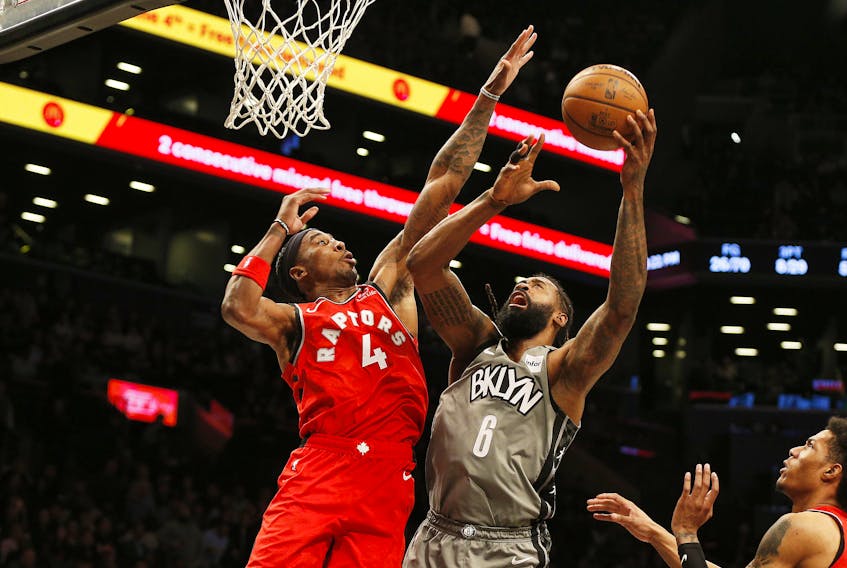 Brooklyn Nets centre DeAndre Jordan (6) shoots against Toronto Raptors forward Rondae Hollis-Jefferson (4) during the second half at Barclays Center. The Raptors don't play again until Friday, Feb. 21.  Andy Marlin-USA TODAY Sports USATSI-407526