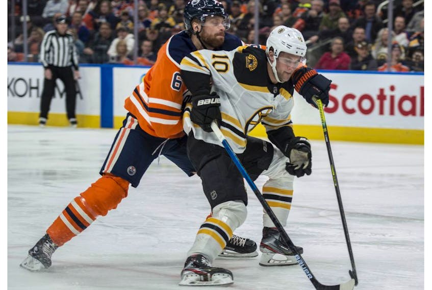 Adam Larsson (6) of the Edmonton Oilers, tries to slow down Anders Bjork of the Boston Bruins at Rogers Place on Wednesday, Feb. 19, 2020. 
