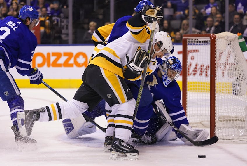 Pittsburgh Penguins forward Sidney Crosby (87) and Toronto Maple Leafs goaltender Frederik Andersen (31) go after a loose puck at Scotiabank Arena. Toronto defeated Pittsburgh. John E. Sokolowski-USA TODAY Sports 