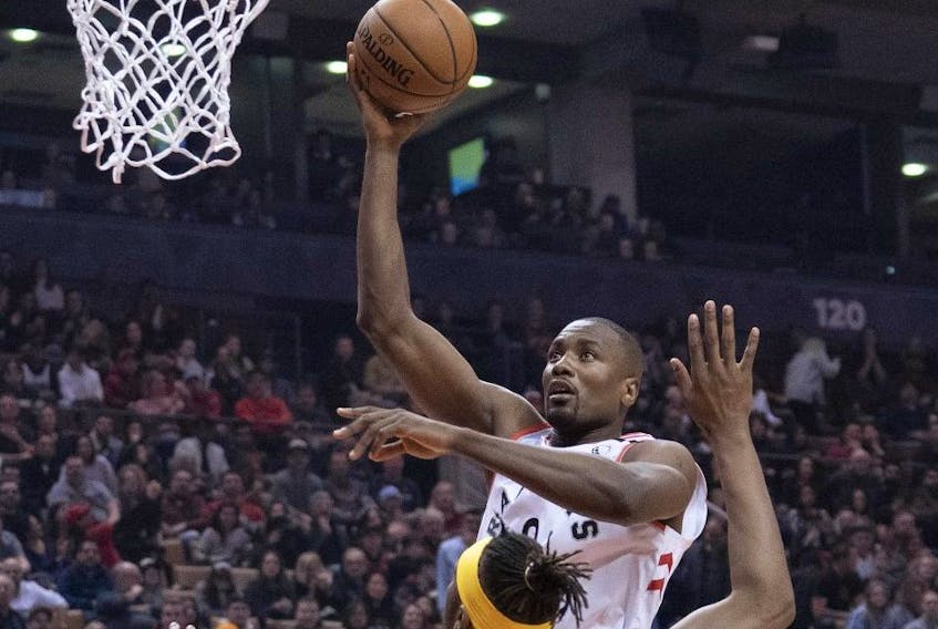 Toronto Raptors centre Serge Ibaka (9) drives to the basket over Indiana Pacers centre Myles Turner (33) during the first quarter at Scotiabank Arena. Nick Turchiaro-USA TODAY