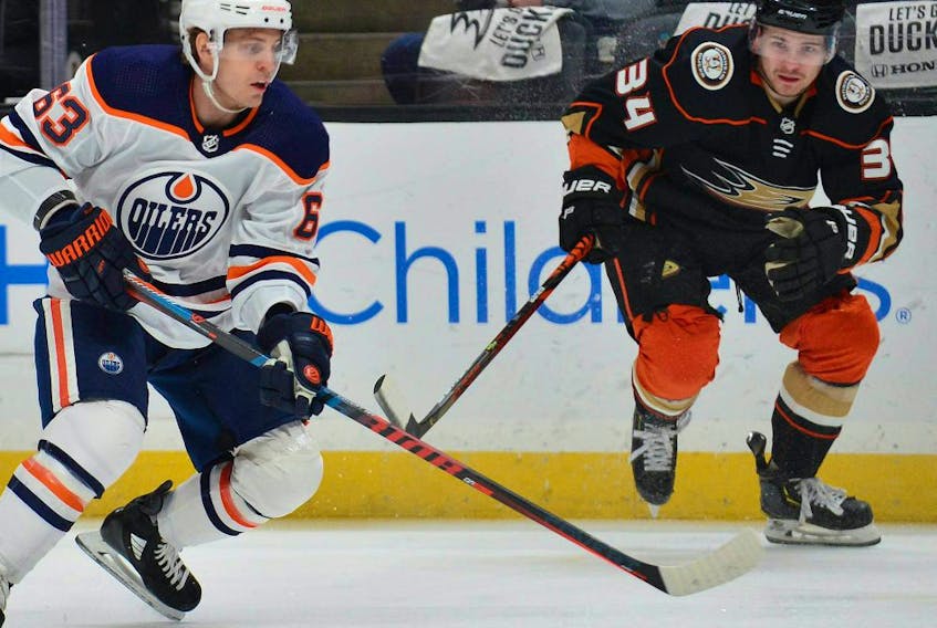 Edmonton Oilers center Tyler Ennis (63) moves in for a shot on goal against the defense of Anaheim Ducks center Sam Steel (34) during the first period at Honda Center.