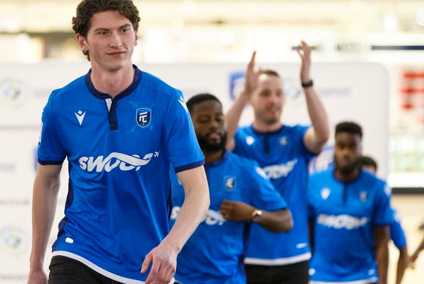 Attacker Easton Ongaro leads a group of players modeling FC Edmonton's new home jersey at West Edmonton Mall on Feb. 27, 2020. He has gone on loan to a team in Denmark.